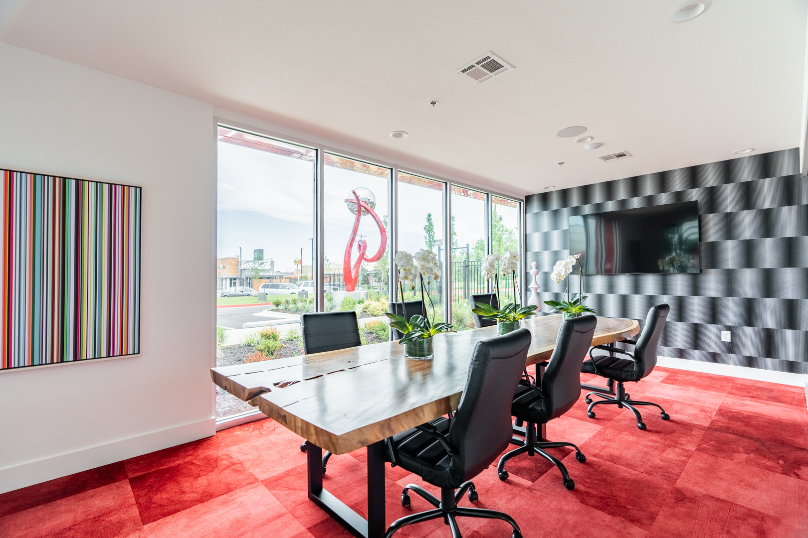 Modern Storage® Springdale conference room with table, chairs, large windows, and bright interior